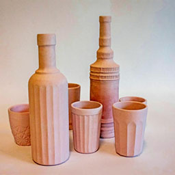 collection of 3D pastel vessels in pastel pink all with textural detail.