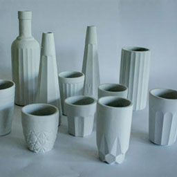 collection of 3D pastel vessels in pastel blue all with textural detail.