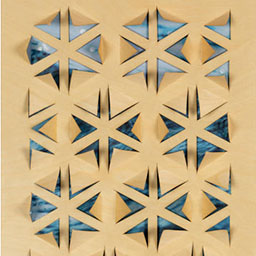 blue star pattern, laser cut onto wooden board.