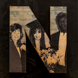 black and white photo in the letter form N, adults standing next to young girl in graduation clothing holding flowers.