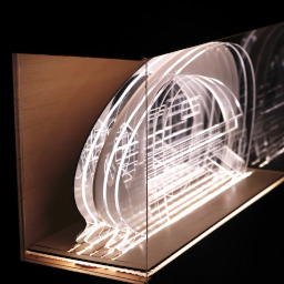 3D geometric acrylic model, dome roof, in a glass case the wooden back under LED lights.