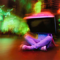 figure of man sitting on floor, TV on head, fluorescent lights, green and pink, blurring image.