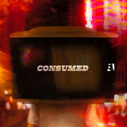 portrait of male figure standing with TV on head, blurred red lights surrounding.