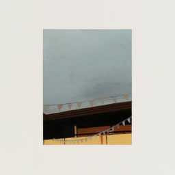 section of roof covered with orange bunting, grey cloudy sky.