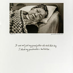 old woman lying down sleeping on bed with white pillow, knitted blanket over her, cursive text below, black and white photograph.
