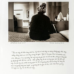 back of woman sitting on bed with beanie on, cursive writing below, black and white photograph.