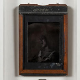 antique black and white portrait, female figure, orange frame.