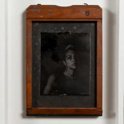 antique black and white portrait, female figure, orange frame.