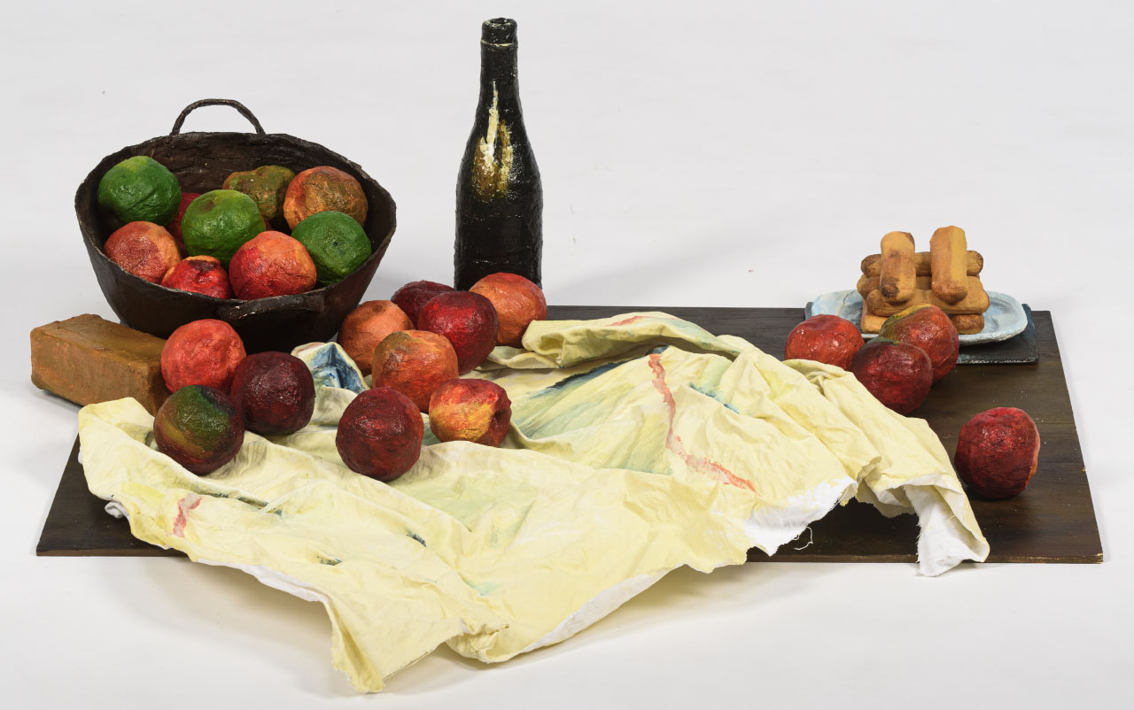 still life painting, apples in a basket and on sheet, jug and plate, sitting on wooden base.