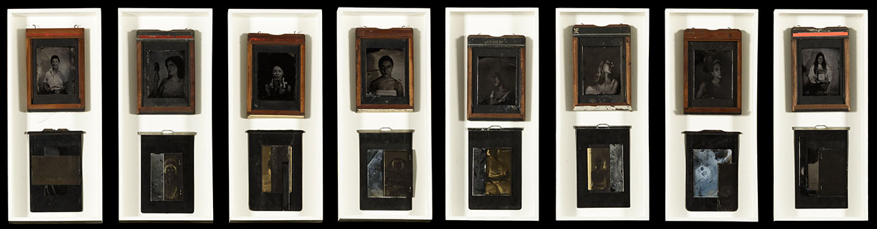 eight long white panels in one row, each with orange frame black and white portrait and antique metal box on a large black background. 