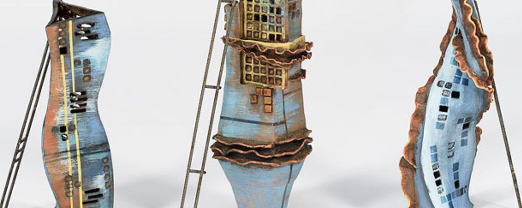 three individual sculptures of abstract high rise buildings in construction, in blues, yellows and with rusty features.