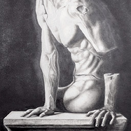 Black and white image of headless male statue-like figure reaching to the side on a bench