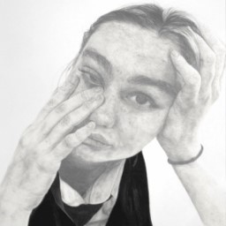 A graphite portrait of a girl resting on one hand and touching her face with the other