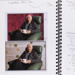 Close up of visual arts diary displaying photographs of an old man for a body of work