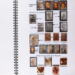 Close up of visual arts diary displaying sketches and images for a body of work